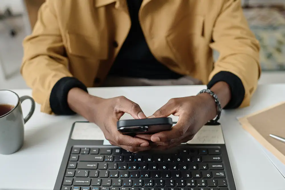 An agent reads a new Google review on their phone and starts typing a professional reply.