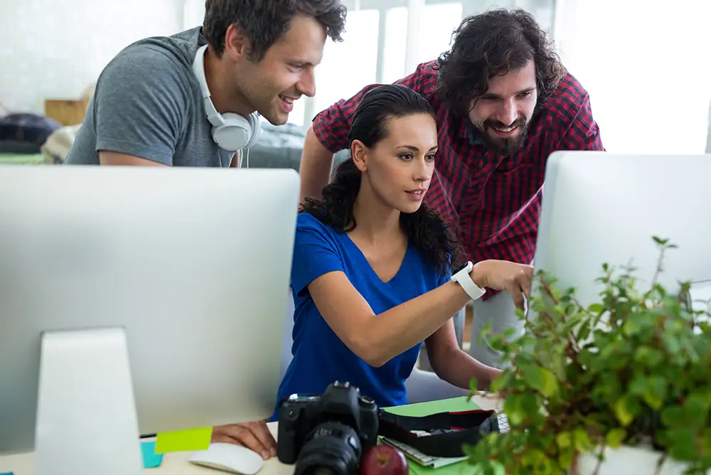 Marketing team analyzing digital SEO strategy for a real estate business.